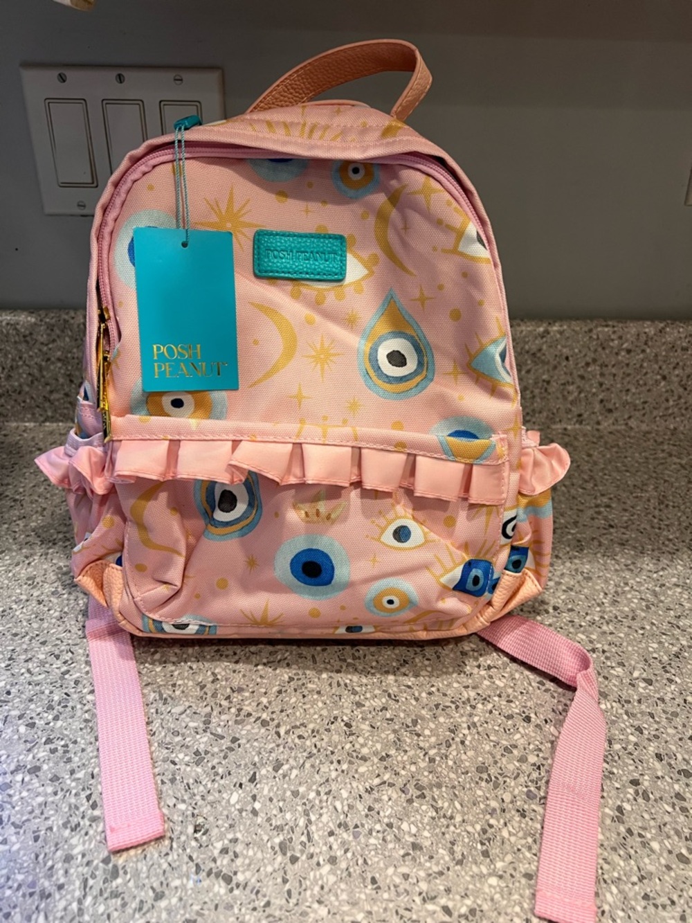 Posh Peanut Pink Ruffle Backpack with Blue & Gold Evil Eye Print (Fiona)